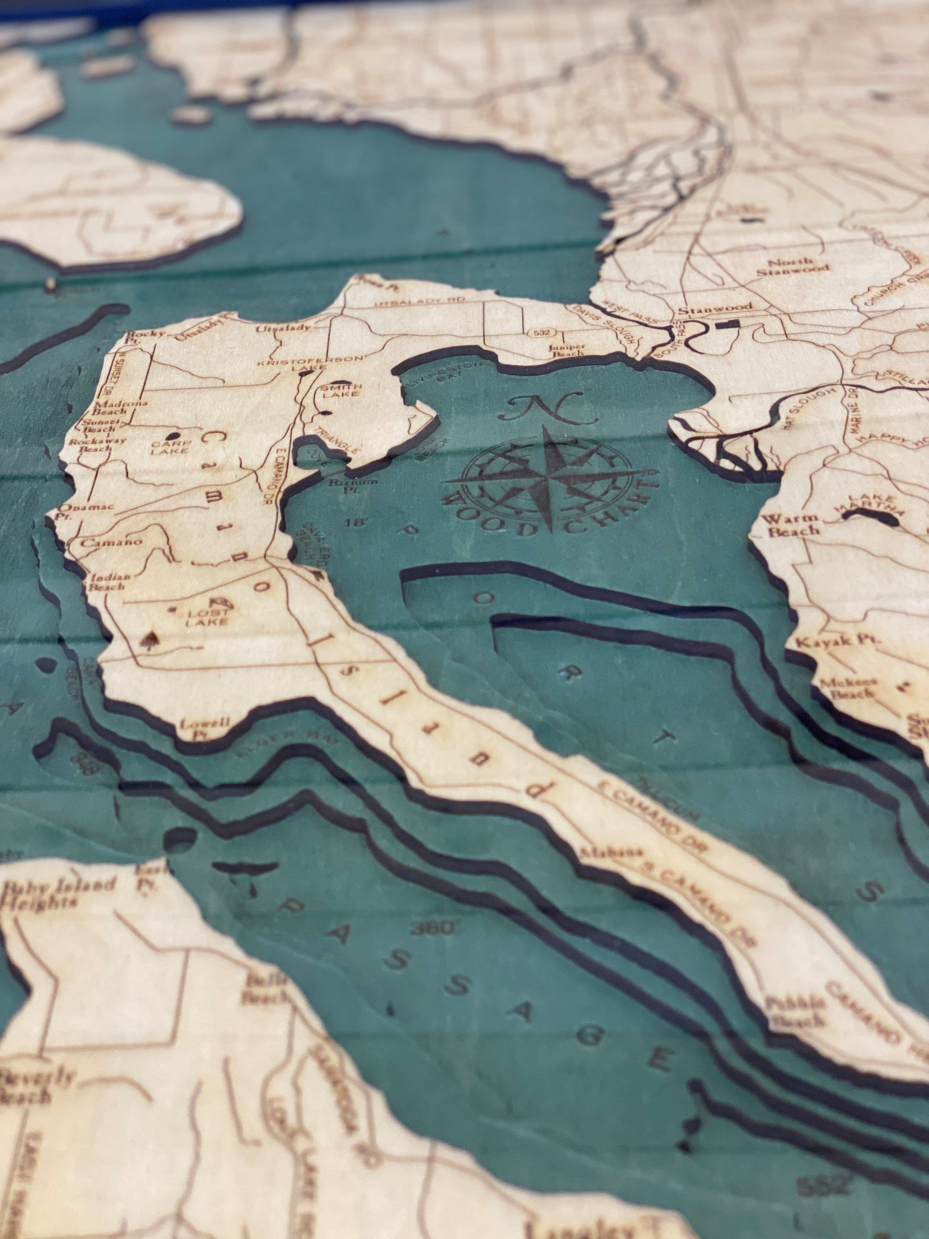 Topographic map of a coastal area with water bodies and landforms.
